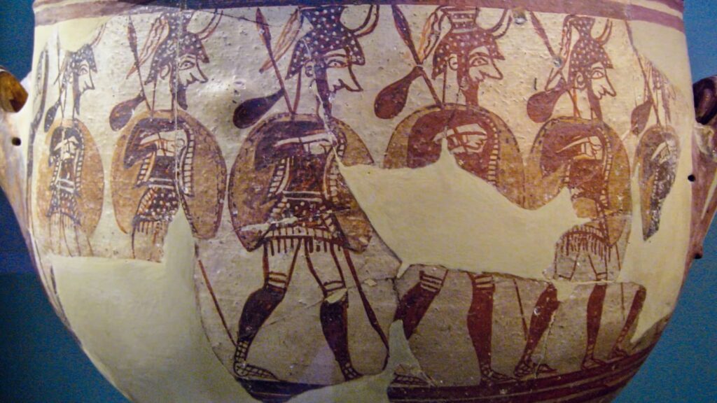 Ancient Greek vase depicting warriors outfitted with greaves
